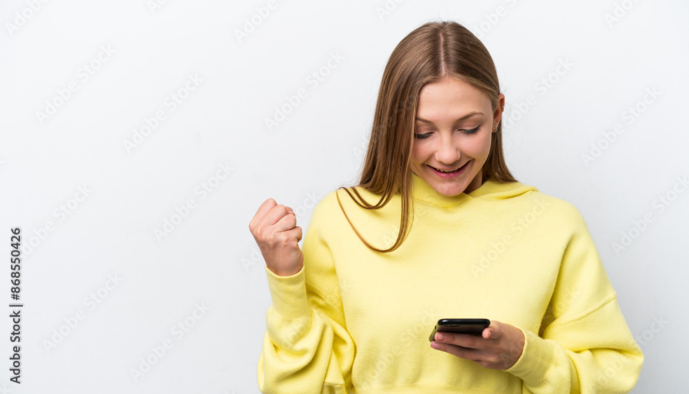 Young Russian woman isolated on white background surprised and sending a message Young Russian woman isolated on white background surprised and sending a message