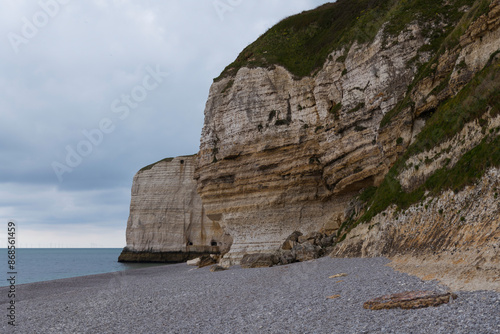 the famous chalk cliffs in etretat photo