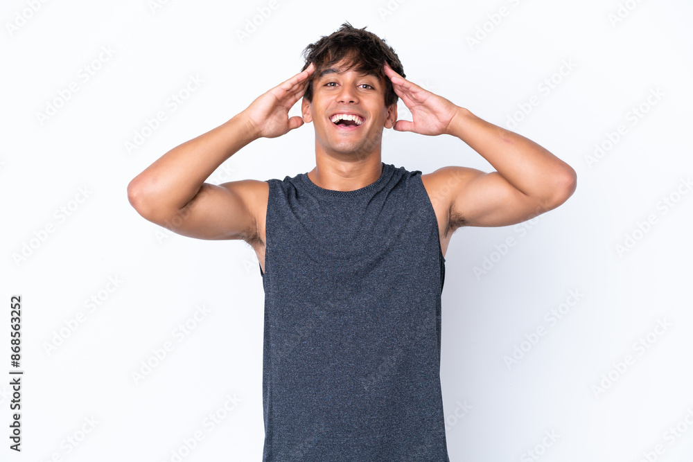 Fototapeta premium Young sport caucasian man isolated on white background with surprise expression