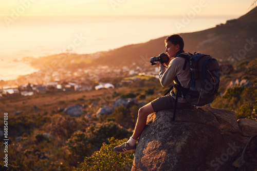 Obraz na plátně Backpack, hiking and photography with man in mountains for adventure, hobby or travel outdoor