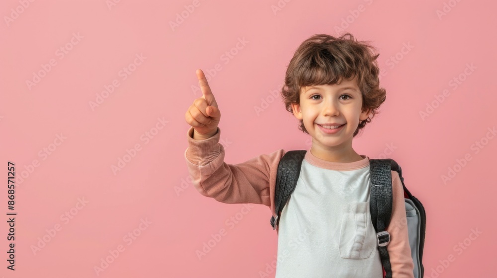 Photo of positive boy kid point finger copyspace hold rucksack isolated pastel color background Photo of positive boy kid point finger copyspace hold rucksack isolated pastel color background