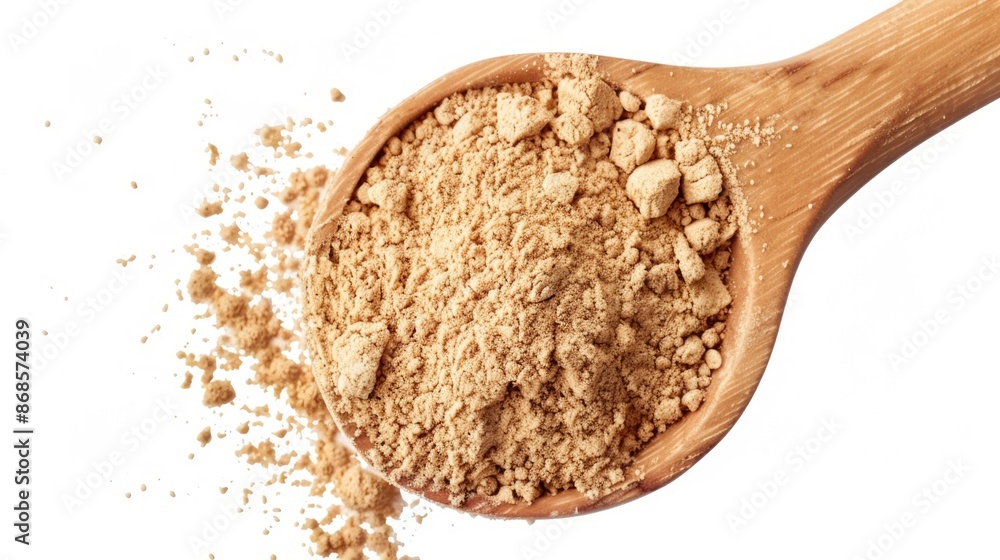 A wooden spoon filled with a mixture of powder, suitable for using in various culinary and craft applications A wooden spoon filled with a mixture of powder, suitable for using in various culinary and craft applications