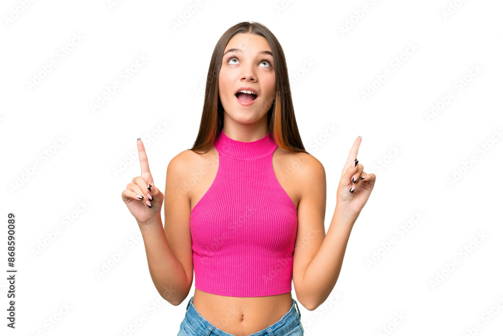 Teenager caucasian girl over isolated background surprised and pointing up Teenager caucasian girl over isolated background surprised and pointing up