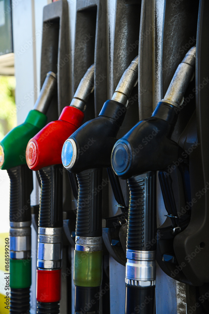 Gas station. Pistols with gasoline and diesel fuel at a car gas station Gas station. Pistols with gasoline and diesel fuel at a car gas station