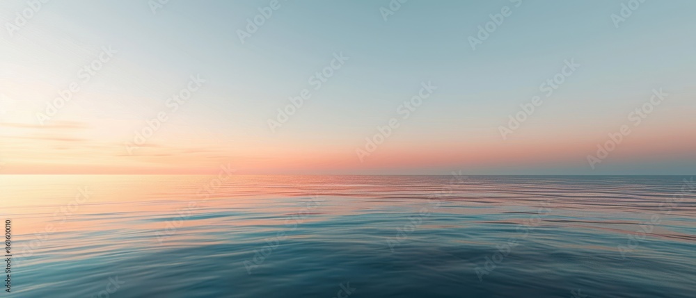 Obraz premium The ocean is calm and peaceful, with a beautiful sunset in the background