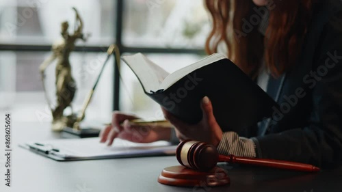 lawyer reading law book and writing and discuss contract  matters of law and contract for clients prepare for the trial.