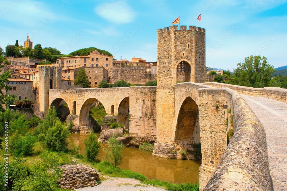Bridge over the river Fluvia in the medieval village Besalú, province Girona, Catalonia, Spain Bridge over the river Fluvia in the medieval village Besalú, province Girona, Catalonia, Spain