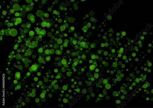 Abstract black background decorated with green circles of various sizes scattered into a beautiful graphic design used for media design.