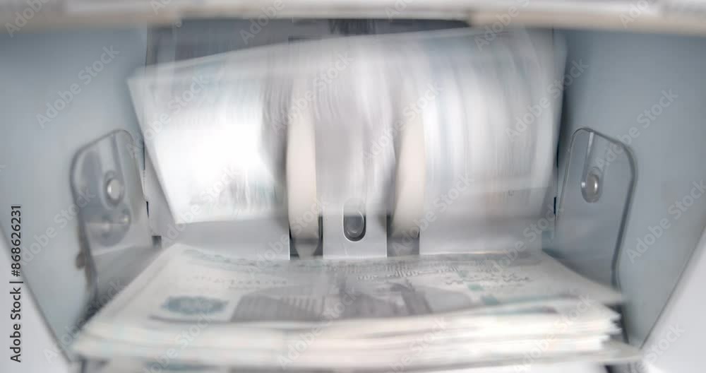 Closeup of Electronic Cash Counting Machine: 100 Egyptian Pound Banknotes Closeup of Electronic Cash Counting Machine: 100 Egyptian Pound Banknotes