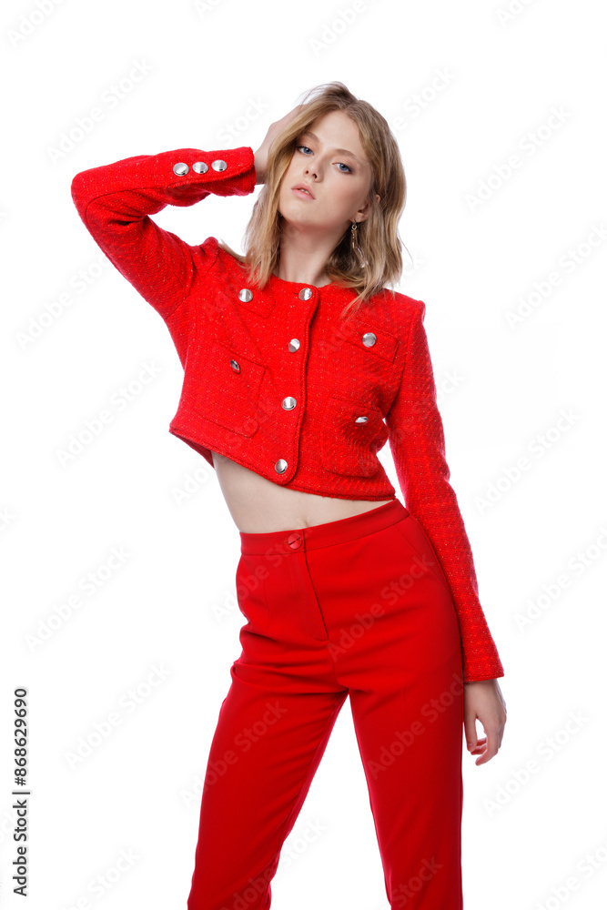 High fashion photo of a beautiful elegant young woman in pretty red pants, trousers, jacket posing on white background. Slim figure. Blonde High fashion photo of a beautiful elegant young woman in pretty red pants, trousers, jacket posing on white background. Slim figure. Blonde