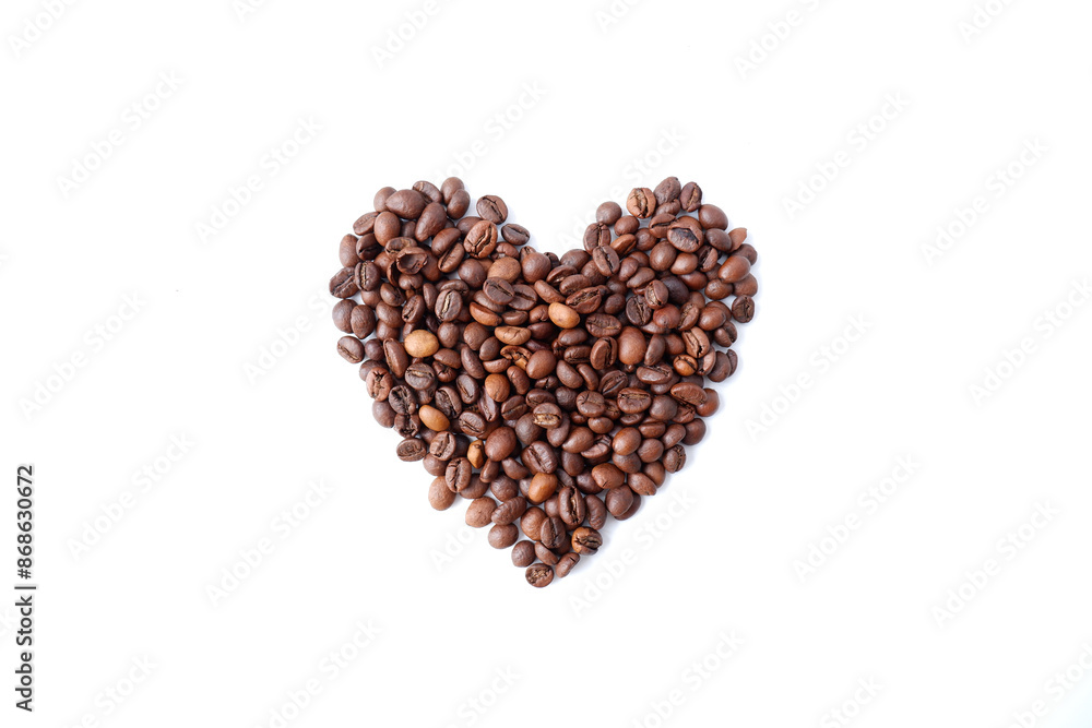 Coffee beans on a white background in the shape of a heart. Coffee beans on a white background in the shape of a heart.