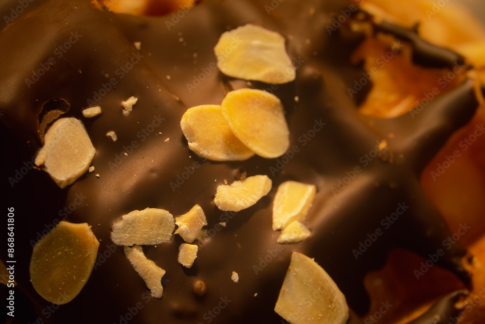 A chocolate dessert with almonds on top A chocolate dessert with almonds on top