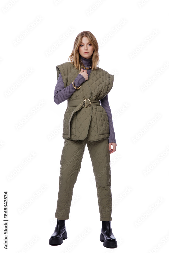 High fashion photo of a beautiful elegant young woman in pretty green pants, trousers, purple blouse, jacket posing on white background. Slim figure. Blonde High fashion photo of a beautiful elegant young woman in pretty green pants, trousers, purple blouse, jacket posing on white background. Slim figure. Blonde