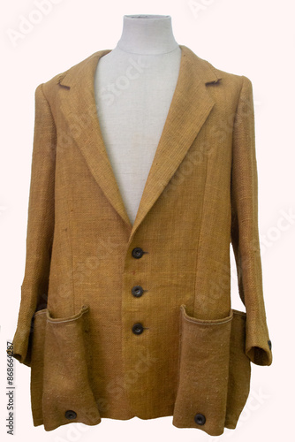 Stylish vintage brown jacket with large pockets, exuding a timeless and rugged appeal. photo