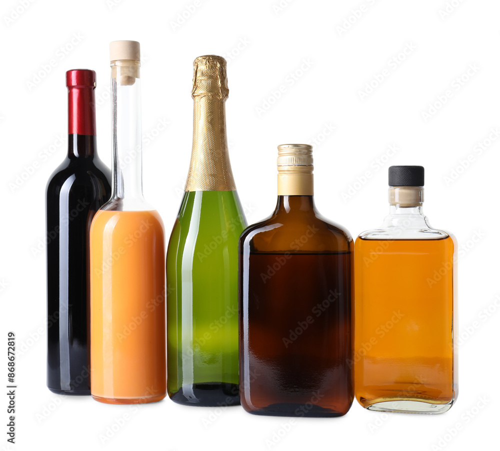 Bottles of different alcoholic drinks isolated on white Bottles of different alcoholic drinks isolated on white