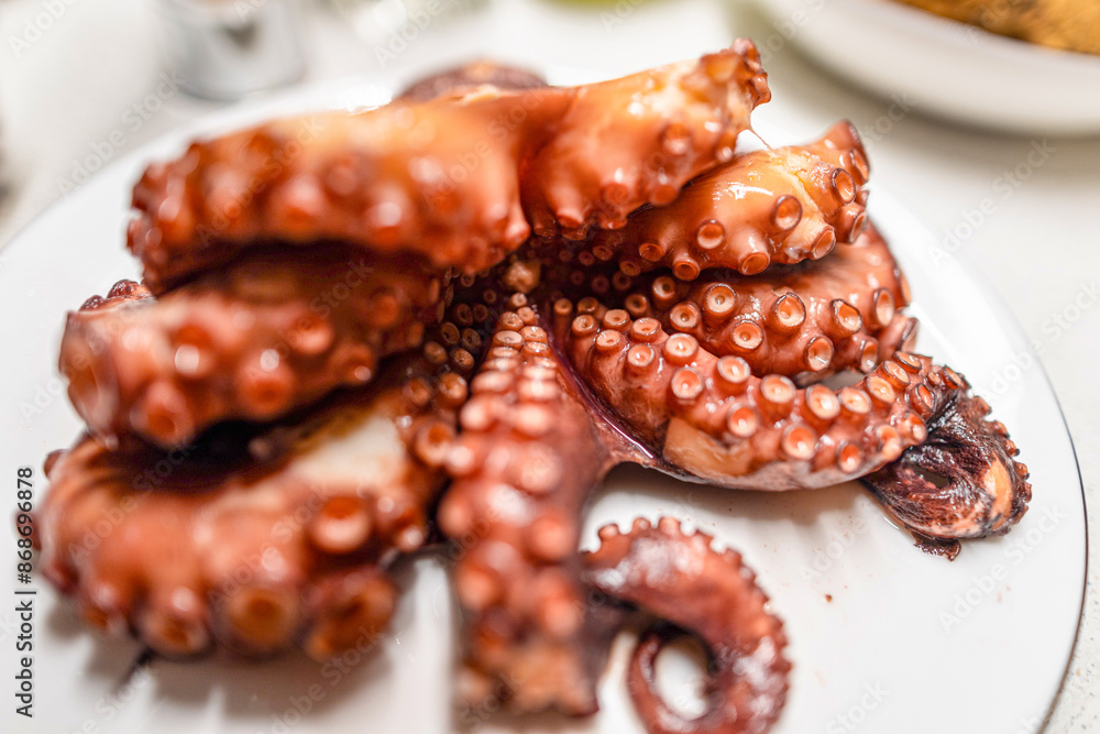 Boiled red octopus is taken out of the pan. Boiled red octopus is taken out of the pan.