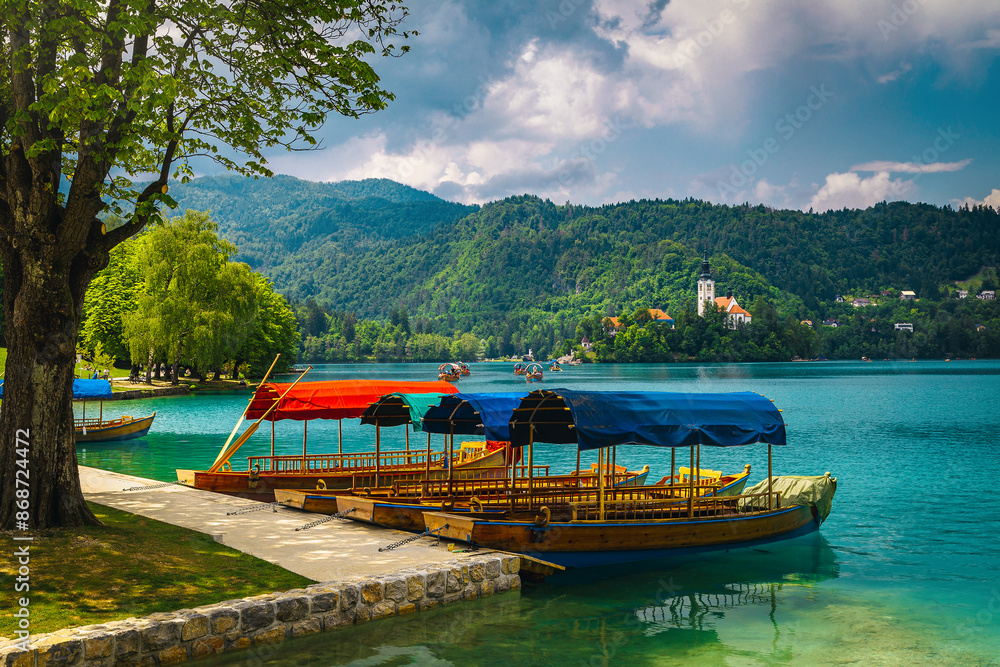 Naklejka premium Anchored pletna boats on the lake Bled, Slovenia
