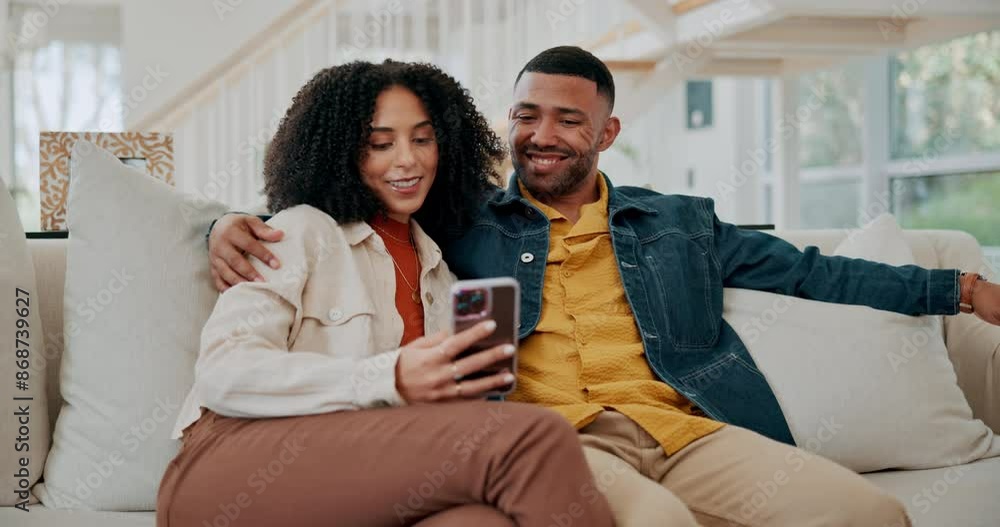 Black couple, phone and hug in home to relax, talking and scroll on social media together on sofa. Happy people, embrace and reading ebook together on weekend, texting and app for online application Black couple, phone and hug in home to relax, talking and scroll on social media together on sofa. Happy people, embrace and reading ebook together on weekend, texting and app for online application