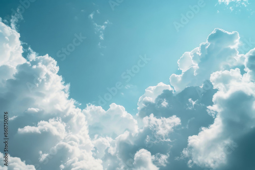 Turquoise Blue Sky with Fluffy Clouds on a Sunny Day, Divine Atmosphere, Perfect for Wallpaper or Background