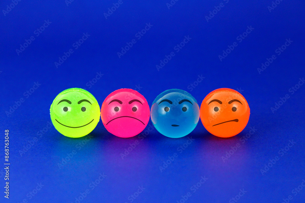 Row of colorful spheres with facial expressions Row of colorful spheres with facial expressions