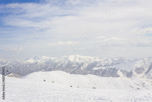 The peaks of snowy Caucasus mountains in The Gudauri Ski Resort, Georgia. Snowboarding in The Gudauri Ski Resort, Georgia