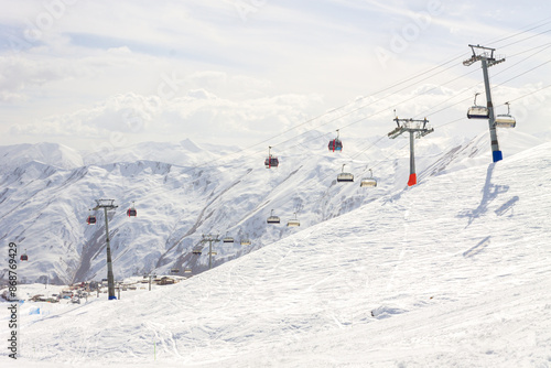 Gudauri Ski Resort: Gondola (Ski Lift) and Snow-covered Caucasus Mountains in Distance - Gudauri, Georgia