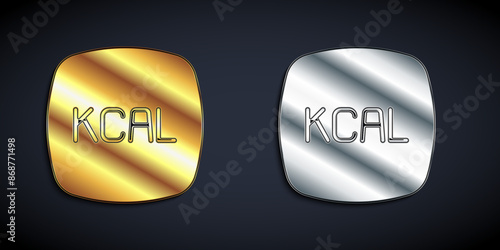 Gold and silver Kcal icon isolated on isolated on black background. Health food. Long shadow style. Vector