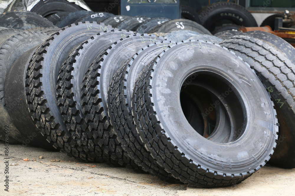 new car tires lined up for installation on cars and trucks new car tires lined up for installation on cars and trucks
