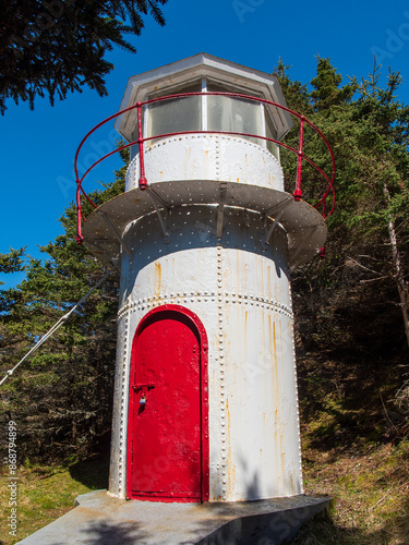 The Cow Head Lighthouse, now inactive, is a two-story steel structure situated on Lighthouse Path in the depression of a headland on the western side of the Cow Head peninsula.  photo