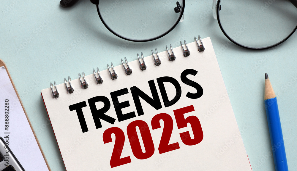 TRENDS 2025 words recorded in an office notebook. TRENDS 2025 words recorded in an office notebook.