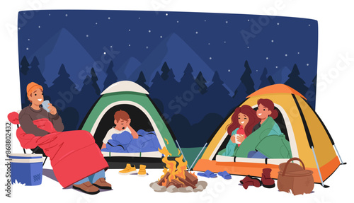 Family Enjoys A Cozy Night Camping Under A Starry Sky With Two Tents And A Campfire. People Relaxing And Drinking