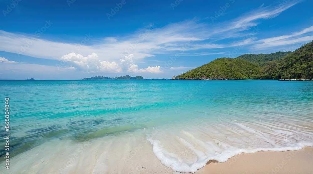 blue sky sea and white waves on beach near the rocks during summer blue sky sea and white waves on beach near the rocks during summer