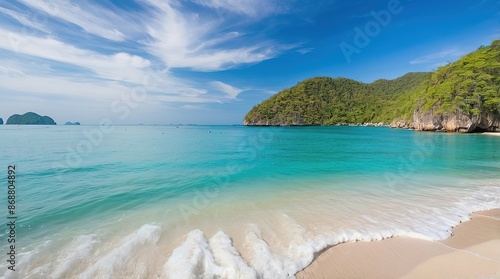 blue sky sea and white waves on beach near the rocks during summer