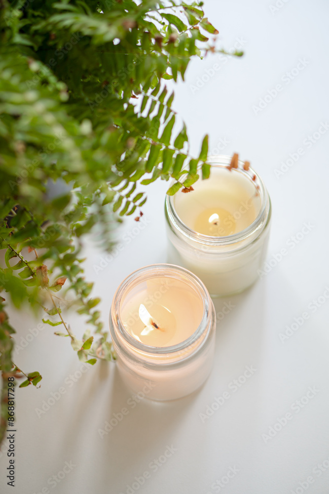 Enhance the ambiance with elegant candles and a fern arrangement for a calming atmosphere Enhance the ambiance with elegant candles and a fern arrangement for a calming atmosphere