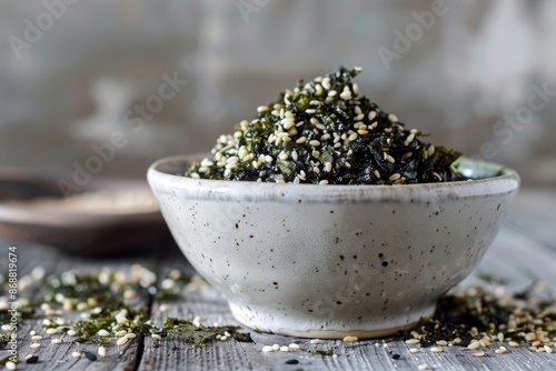 White bowl with Nori flakes furikake seasoning featuring sesame seed and salt photo