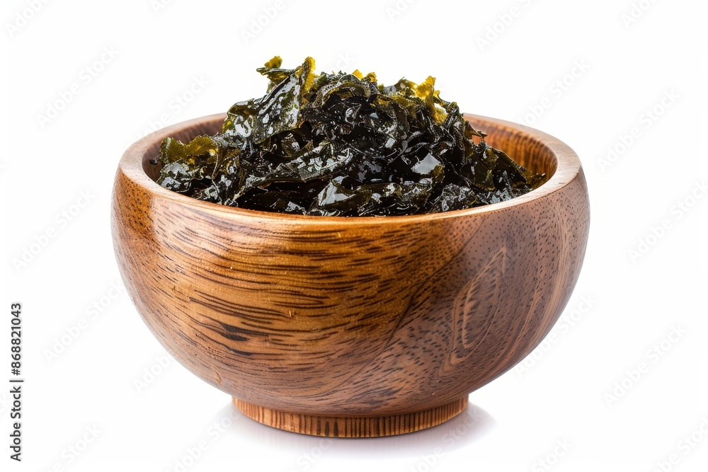 Wooden bowl of Korean snack with crispy nori seaweed isolated on white background With clipping path Wooden bowl of Korean snack with crispy nori seaweed isolated on white background With clipping path