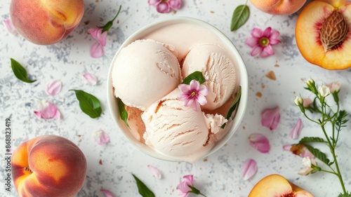 Peach ice cream with floral garnish, surrounded by fresh peaches and petals