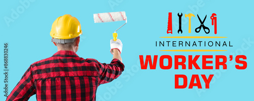 Mature worker with paint ro...