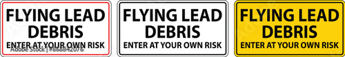 caution sign warning about the dangers of flying lead debris, indicating entry at one's own risk.