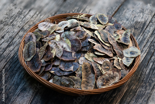 Senna alexandrina P. Miller dried pods on an old wooden background. photo