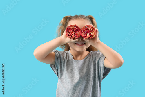 Cute little girl with pomeg...