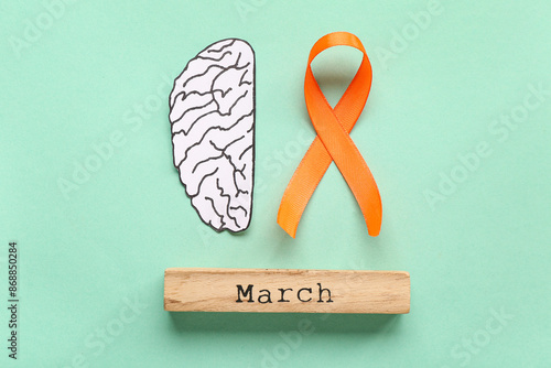Paper brain with orange rib...