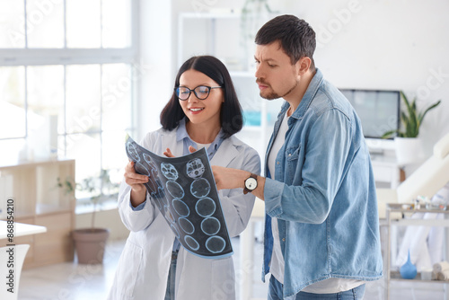 Female doctor and male pati...