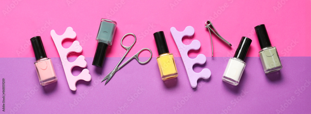 Nail polishes, clippers, scissors and toe separators on color background, flat lay. Banner design Nail polishes, clippers, scissors and toe separators on color background, flat lay. Banner design