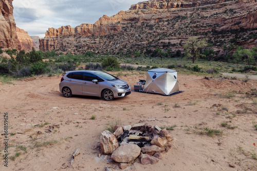 silver car and silver tent car camping in a canyon in Buckhorn Wash, Utah, United States of America.