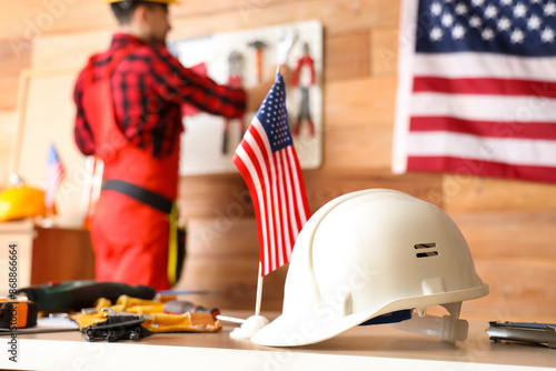 USA flag with hardhat on ta...