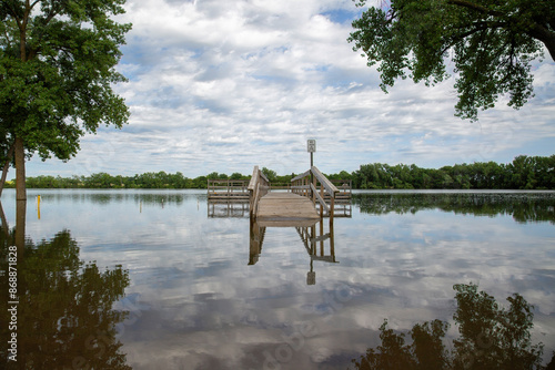 Beautiful Landscape at Cottonwood Lake Floating Dock Pier with Trees and Blue Sky Cloud Reflection, June 23, 2024 Historic Flooding, Tegels Park, Windom, Minnesota photo