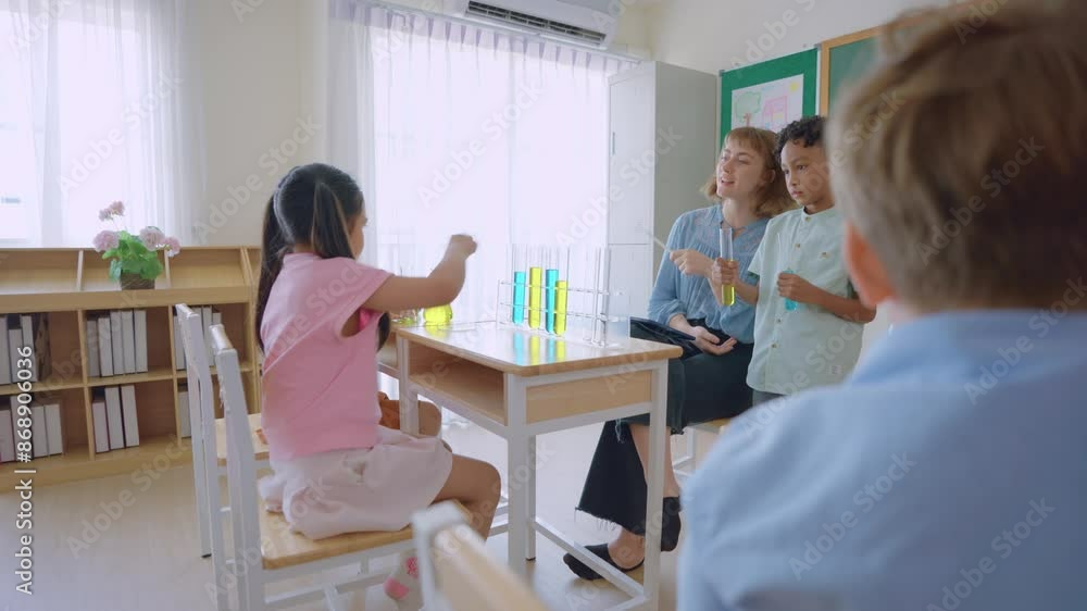 Adorable student learn with teacher in classroom at elementary school. Adorable student learn with teacher in classroom at elementary school.