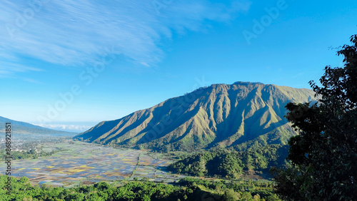 green hills, peaks of Pergasingan hills around Mount Rinjani. its landscape for hiking and outdoor lifestyle concept. beautiful natural scenery