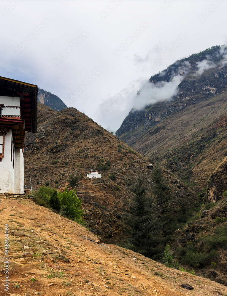 Monastery buildings with Cedars and green hills, Central Bhutan Monastery buildings with Cedars and green hills, Central Bhutan